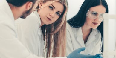 Scientists reviewing Magnecine compound research